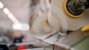 Close-up spools of yarn thread. Textile factory equipment. Textile factory. Spinning production. Yarn making processes