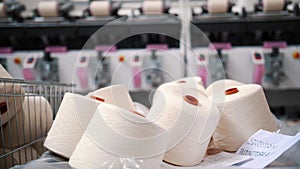 Close-up spools of yarn thread. Textile factory equipment. Threads production. Textile factory. Spinning production