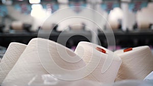 Close-up spools of yarn thread. Yarn making processes. Threads production. Textile factory equipment. Textile factory