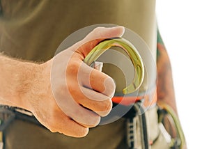 Close-up of sporty man hand with snap hook carabiner.