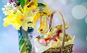 Close up of spring flowers and Easter foil wrapped rabbits