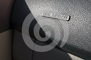 Close up of SRS airbag on car dashboard.