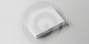 A close-up of a stack of blank, white business cards on a white surface