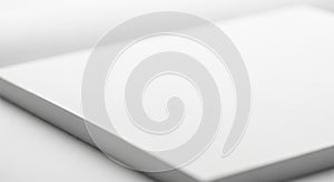 A close-up of a stack of blank white paper with a smooth texture. The focus is on the corner and
