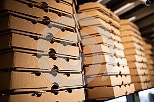 Close-up of a stack of brown pizza delivery boxes