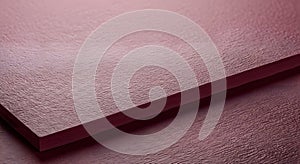 Close-up of a Stack of Burgundy Paper