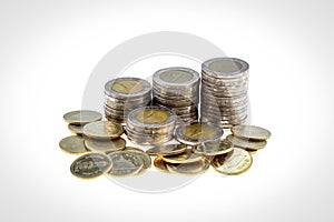 Close up stack of coin on white background and business or finance saving money