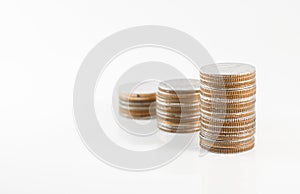 Close up stack of coins on white background for financial and sa