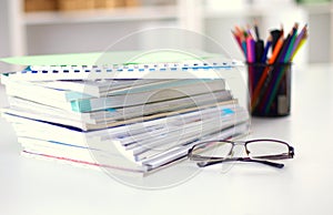 Close up of stack of papers on white background