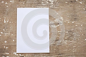 Close up of stack of papers on wooden background