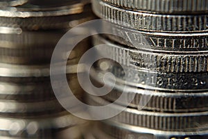 Close up of stack of silver coins showing increasing value