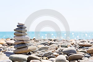 Close-up of stack of stones in perfect balance on a beautiful sunny beach