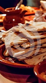 Close up of a Stack of Warm Flatbreads on a Rustic Dish
