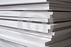 Close up of stack of white extruded polystyrene sheets insulative material for buildings