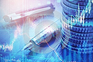 Close up of stacked coins, pen and forex chart on blurry desktop background. Financial management, money and profit concept.