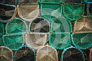 Close-up of stacked fishing cage traps