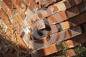 Close up of stacked red clay bricks.