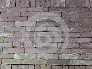 Close up of a staggered red brick path