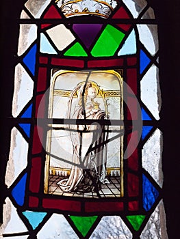 Close up of stained glass window with light inside church