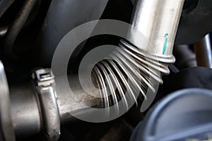 Close-up of Stainless Pipes of a turbo Car Engine