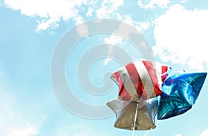 Close up of Star Balloons Flying in Blue Sky