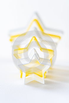 Close up star shaped pastry cutter on a white background