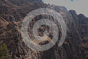 Close up of the stark mountainside and ridgeline of the Patacancha Mountain in the Andes Mountain range in Peru