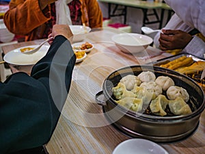 Close up Steamed Baozi or bun and dumpling the famous chinese cuisine on the table