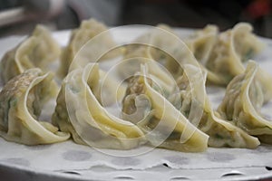 Close up steamed Korean dumplings served at a restaurant