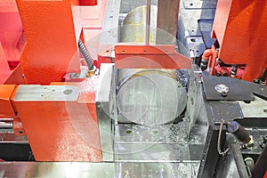 Close up steel band saw machine working in factory