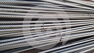 Close up steel bar or steel reinforcement bar in the construction site with sunbeam at the morning, steel rods bars can be used