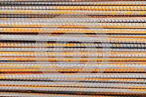 Close up steel rebar for building texture in the construction site. Rebar is an important building material. Rusty iron bars at th