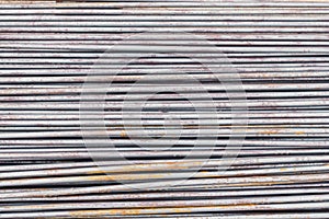 Close up steel rebar for building texture in the construction site. Rebar is an important building material. Rusty iron bars at th