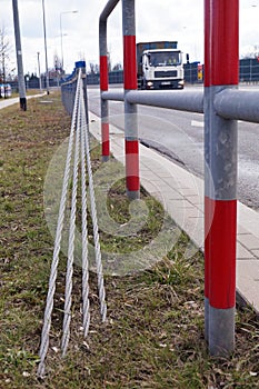 Close-up of steel ropes. Cable barrier, also called guard cable or wire road safety barrier, is increasingly used road safety