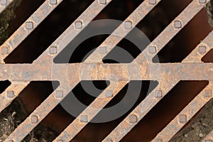 Close-up of steel sewage grate public system