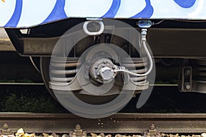 Close up of steel train wheel on rail track