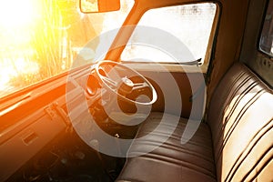 Close up of the steering wheel of an abandoned rusty old car.Old Car Interior, Vintage