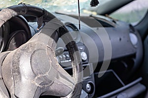 Close-up of the steering wheel of a car after an accident. The driver\'s airbags did