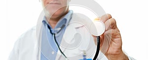 Close up stethoscope in hand of doctor. listening equipment pulse and heart. diagnosis heartbeat. banner copy space