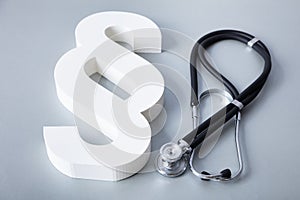 Close-up Of Stethoscope And Paragraph Symbol