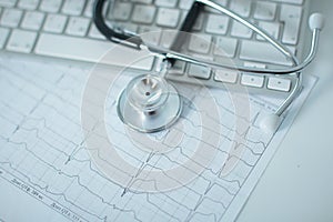 Close up of stethoscope on pc keyboard. Healthcare concept