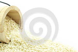 Close up sticky rice in wooden isolated onwhite background photo