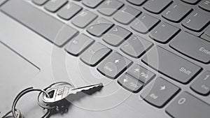 Close up of Still life of Key Ring on laptop computer keyboard. Conceptual image shown as network security key. Cyber Security,