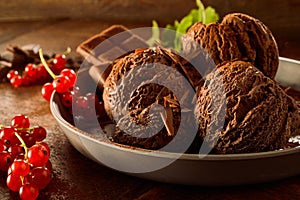 Chocolate Ice Cream with Red Currants in Dish