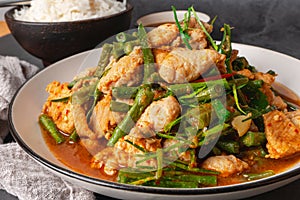 Close up, Stir-fried pork and red hot curry paste with or long bean and Ingredients are oyster sauce, fish sauce, sugar, kaffir