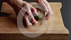 A close-up stock video showcasing a ripe avocado placed on a wooden cutting board