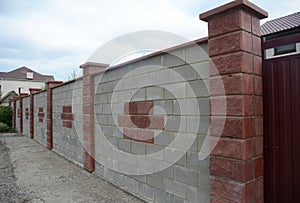 Close up on Stone, Brick, Block Fence Wall. Natural Fencing.