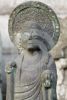 Close-up of stone Buddhist monk statue