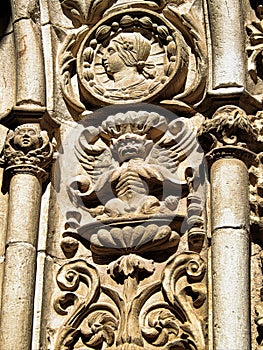 A close up of stone Grotesque carved face