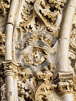 A close up of stone Grotesque carved face